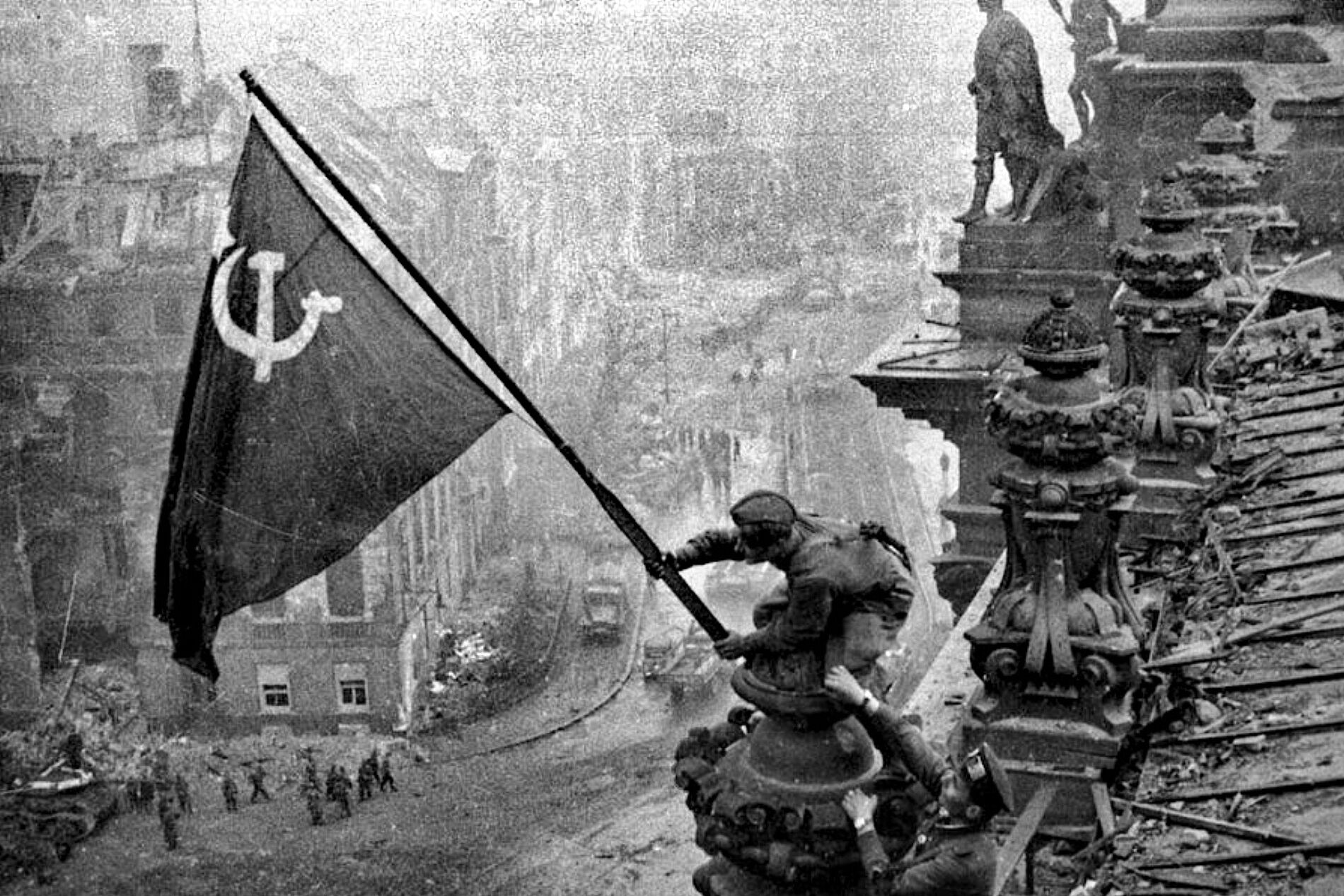 Raising a flag over the Reichstag, Berlin, May 1945
